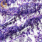 Błyszczący brokatowy fioletowy haftowany materiał koronkowy Luksusowe perły na suknię wieczorową